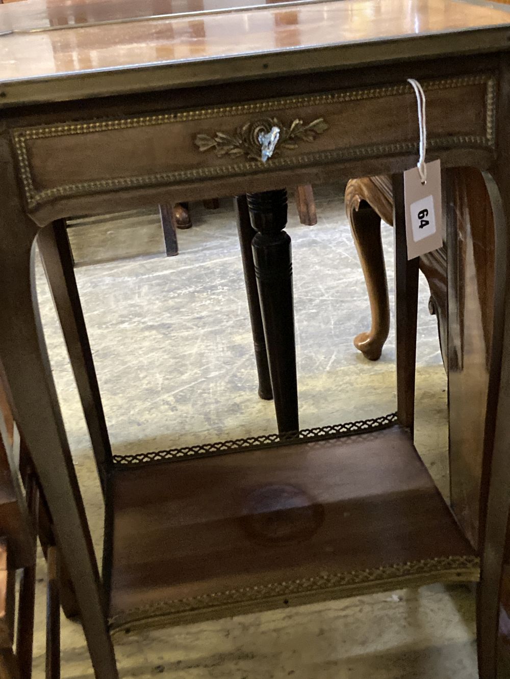 A French gilt metal mounted mahogany two tier table, width 46cm, depth 36cm, height 78cm